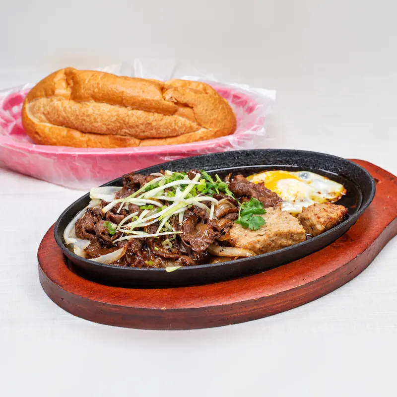 Sizzling Steak & Eggs · Bánh Mì Bò Né